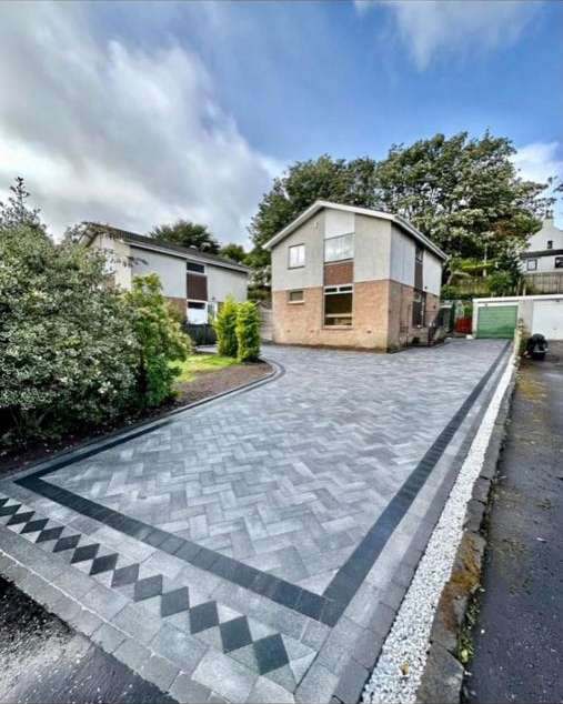 Grey herringbone block paving driveway with diamond pattern border detail